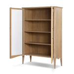 Traditional design defines this light-finished oak cabinet. Simple, clean side panels highlight a softly curved bottom frame. Steel handles in a copper patina finish add a unique touch.As fans of wabi sabi design at Amethyst, we love the nature inspired Gates Cabinet - Light Natural Oak Veneer. Amethyst Home provides interior design, new home construction design consulting, vintage area rugs, and lighting in the Monterey metro area.