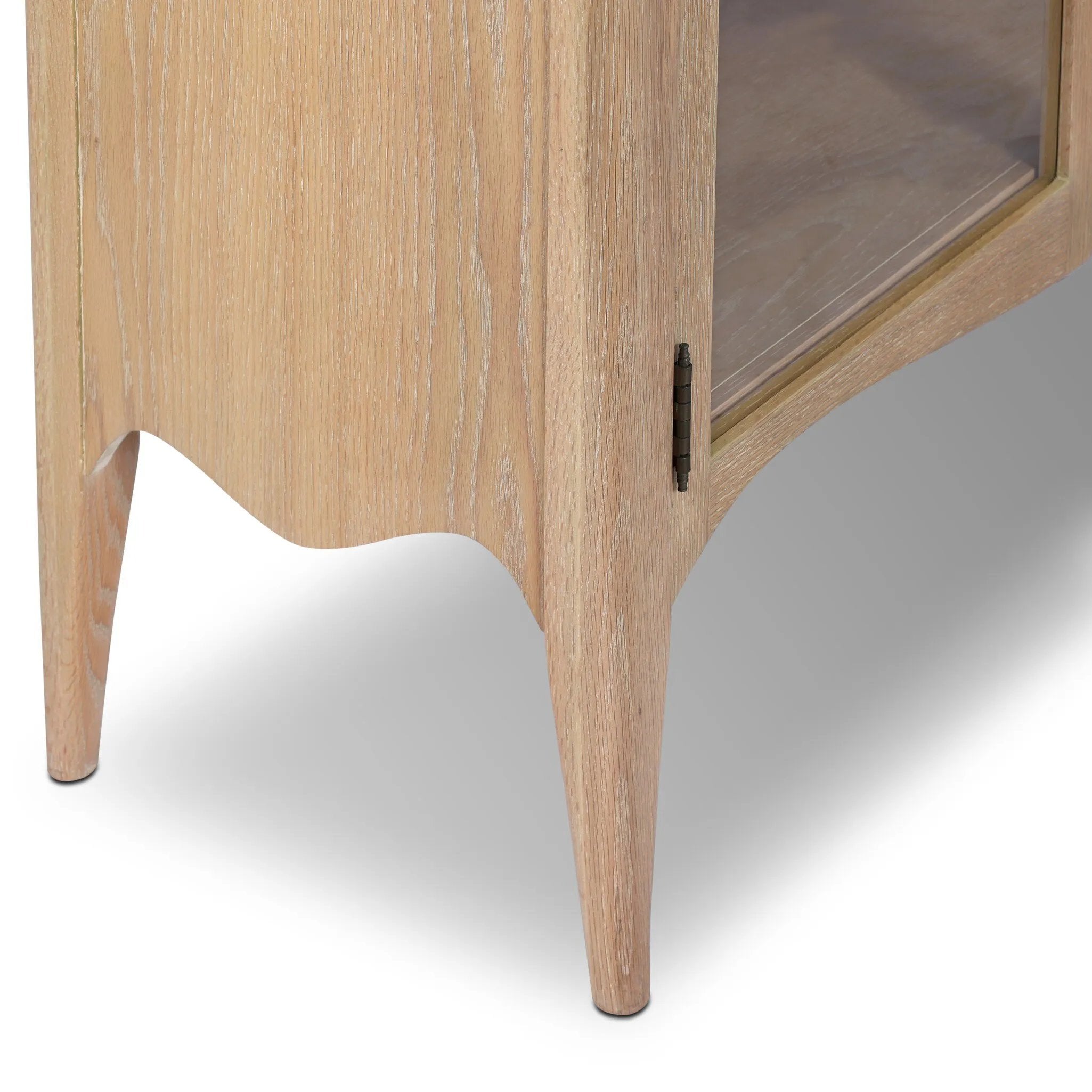 Traditional design defines this light-finished oak cabinet. Simple, clean side panels highlight a softly curved bottom frame. Steel handles in a copper patina finish add a unique touch.As fans of wabi sabi design at Amethyst, we love the nature inspired Gates Cabinet - Light Natural Oak Veneer. Amethyst Home provides interior design, new home construction design consulting, vintage area rugs, and lighting in the Omaha metro area.