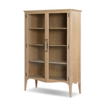 Traditional design defines this light-finished oak cabinet. Simple, clean side panels highlight a softly curved bottom frame. Steel handles in a copper patina finish add a unique touch.As fans of wabi sabi design at Amethyst, we love the nature inspired Gates Cabinet - Light Natural Oak Veneer. Amethyst Home provides interior design, new home construction design consulting, vintage area rugs, and lighting in the Washington metro area.