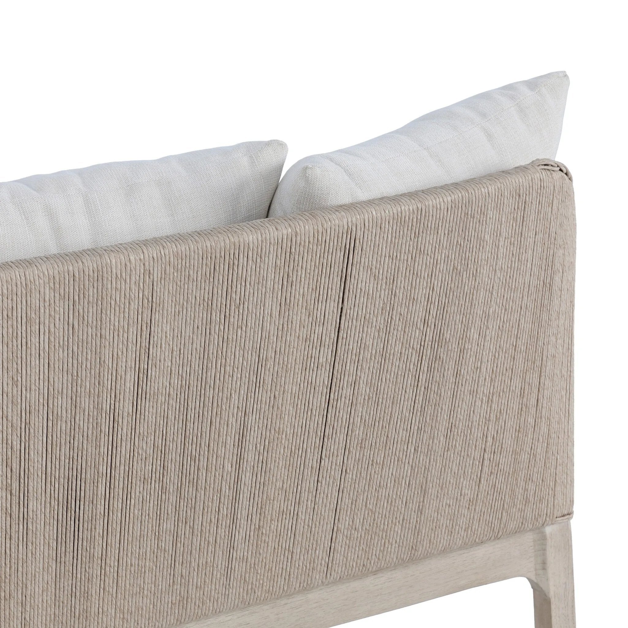Dove-grey teak with a washed finish, linen-like upholstery and a braided woven seatback blend together for a monochromatic look on this outdoor sofa, perfect for small spaces. The slightly sun-aged look comes together for a style that evokes coastal vibes. Cover or store inside during inclement weather or when not in use. Amethyst Home provides interior design, new home construction design consulting, vintage area rugs, and lighting in the Dallas metro area.