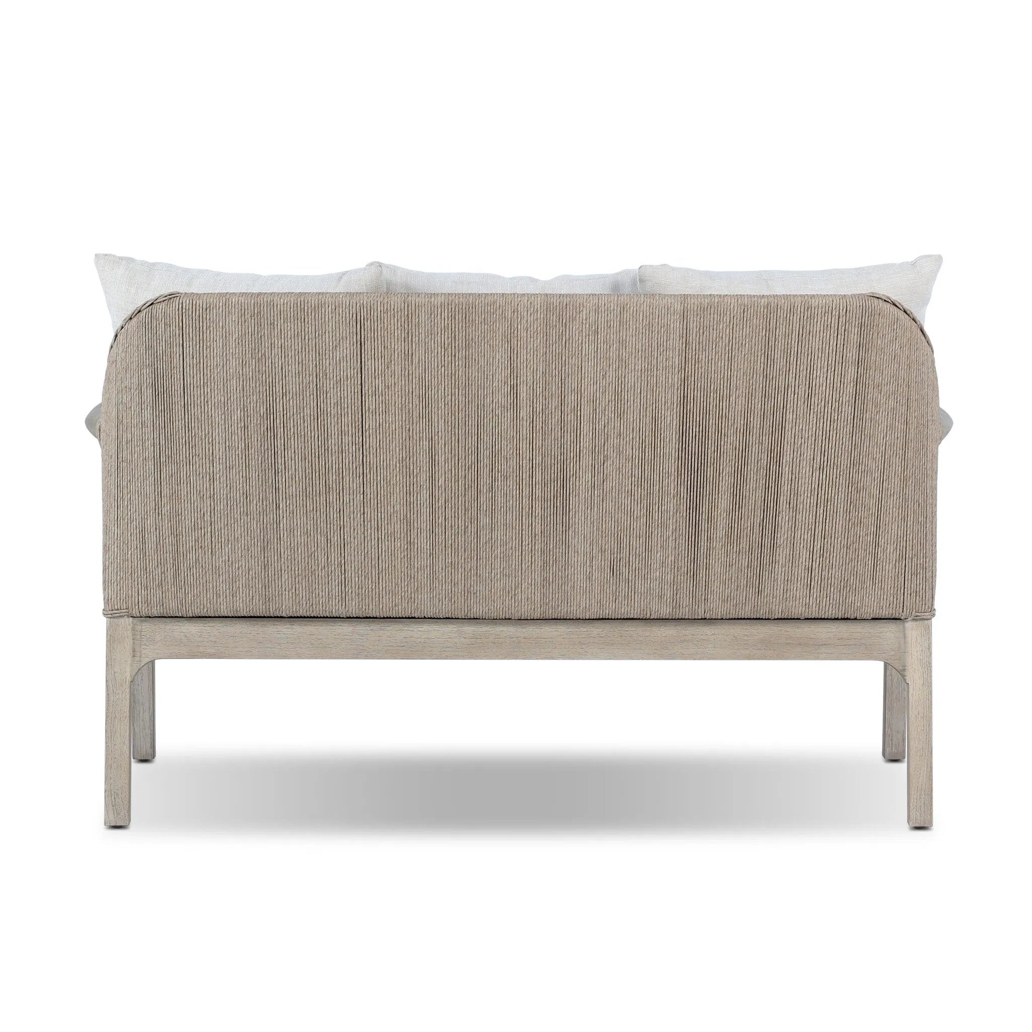 Dove-grey teak with a washed finish, linen-like upholstery and a braided woven seatback blend together for a monochromatic look on this outdoor sofa, perfect for small spaces. The slightly sun-aged look comes together for a style that evokes coastal vibes. Cover or store inside during inclement weather or when not in use. Amethyst Home provides interior design, new home construction design consulting, vintage area rugs, and lighting in the San Diego metro area.