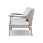 Dove-grey teak with a washed finish, linen-like upholstery and a braided woven seatback blend together for a monochromatic look on this outdoor sofa, perfect for small spaces. The slightly sun-aged look comes together for a style that evokes coastal vibes. Cover or store inside during inclement weather or when not in use. Amethyst Home provides interior design, new home construction design consulting, vintage area rugs, and lighting in the Tampa metro area.