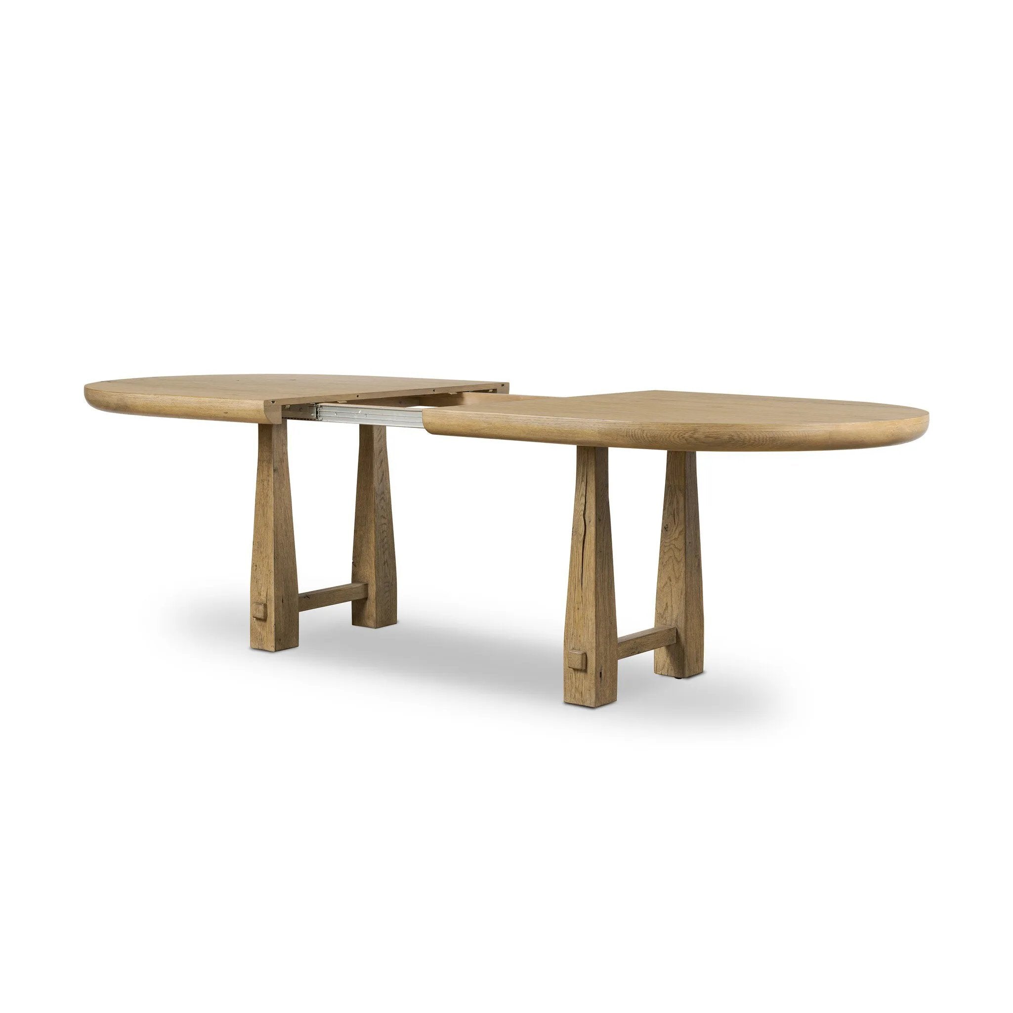 Make space to gather around. This extendable dining table is crafted from drifted oak veneer with a semi-trestle base, thick legs and an oval-shaped surface. The extension expands the table from 84" to a roomier 104" Amethyst Home provides interior design, new home construction design consulting, vintage area rugs, and lighting in the Nashville metro area.