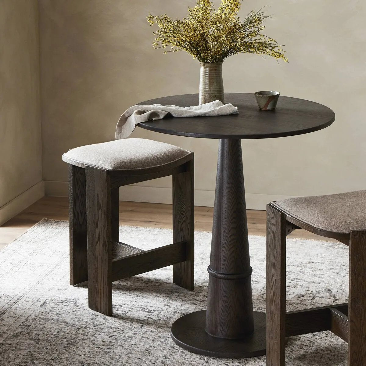 Featuring Goetz Brown Oak Veneer Counter Table by Four Hands at Amethyst Home. For this fresh take on traditional tulip shaping, a solid oak base with ring detailing pairs with an oak veneer tabletop. Perfectly sized for the counter.
Overall Dimensions: 32.0" L x 32.0 " W x 36.5" H
Collection: AllstonColors: Brown Oak VeneerMaterials: Oak Veneer, Solid Oak, Po. Amethyst Home provides interior design, new home construction design consulting, vintage area rugs, and lighting in the Austin metro area.