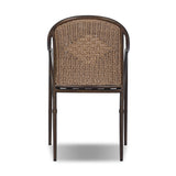This outdoor dining chair takes inspiration from classic French bistro-style chairs, featuring a distinctive metal collar detail on the arms. The woven seatback comes together in a diamond pattern, finished with a cream-colored seat cushion. Cover or store inside during inclement weather and when not in use. Amethyst Home provides interior design, new home construction design consulting, vintage area rugs, and lighting in the Boston metro area.
