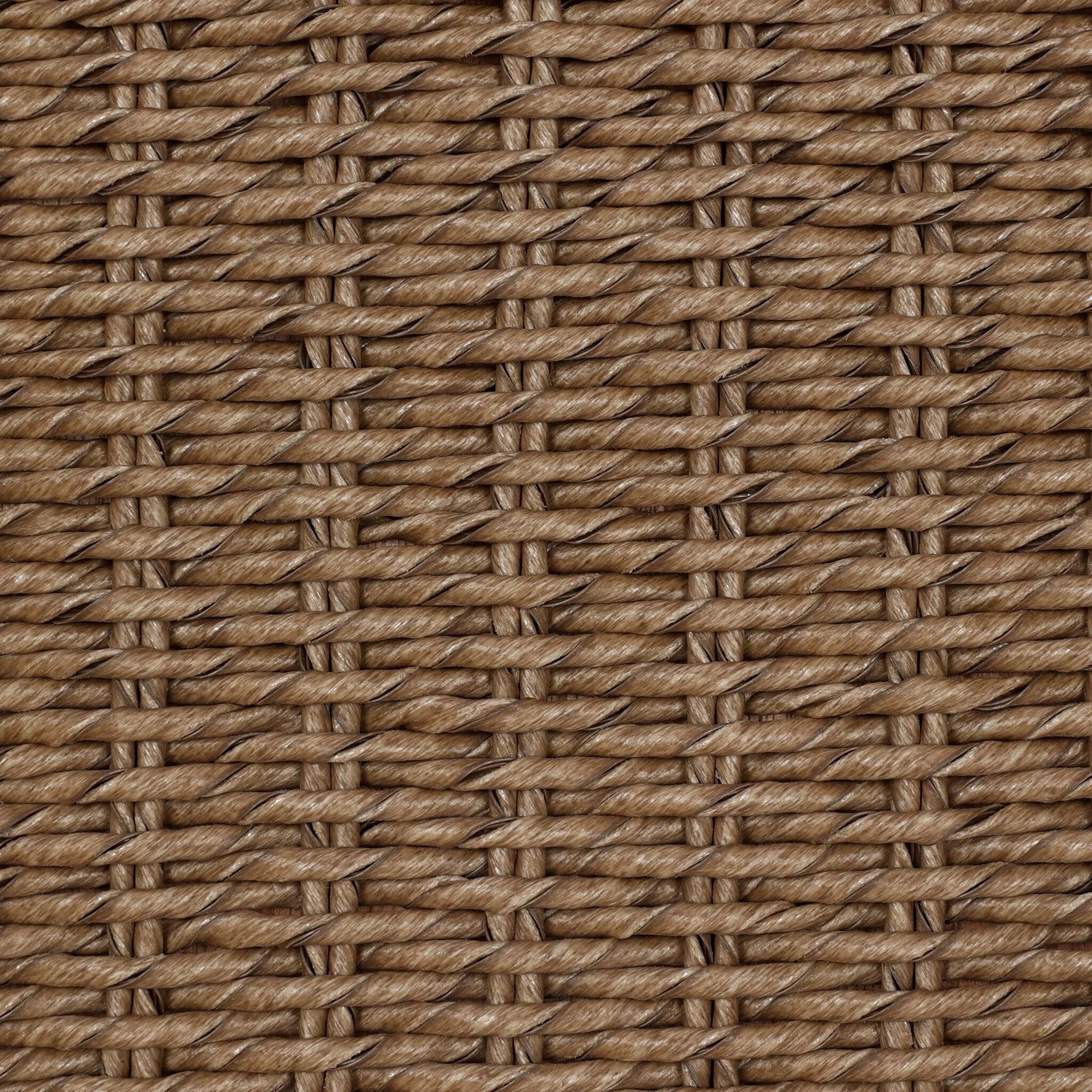 This outdoor dining chair takes inspiration from classic French bistro-style chairs, featuring a distinctive metal collar detail on the arms. The woven seatback comes together in a diamond pattern, finished with a cream-colored seat cushion. Cover or store inside during inclement weather and when not in use. Amethyst Home provides interior design, new home construction design consulting, vintage area rugs, and lighting in the Calabasas metro area.