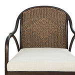 This outdoor dining chair takes inspiration from classic French bistro-style chairs, featuring a distinctive metal collar detail on the arms. The woven seatback comes together in a diamond pattern, finished with a cream-colored seat cushion. Cover or store inside during inclement weather and when not in use. Amethyst Home provides interior design, new home construction design consulting, vintage area rugs, and lighting in the Houston metro area.