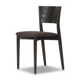 Inspired by simple Scandinavian styling, a dark-finished parawood stool's slit-back metal inlay adds a decorative touch. Easy curves from bent wood give a smooth silhouette. Upholstered with a thin seat cushion upholstered in black performance fabric, perfect for everyday dining. Amethyst Home provides interior design, new home construction design consulting, vintage area rugs, and lighting in the Houston metro area.