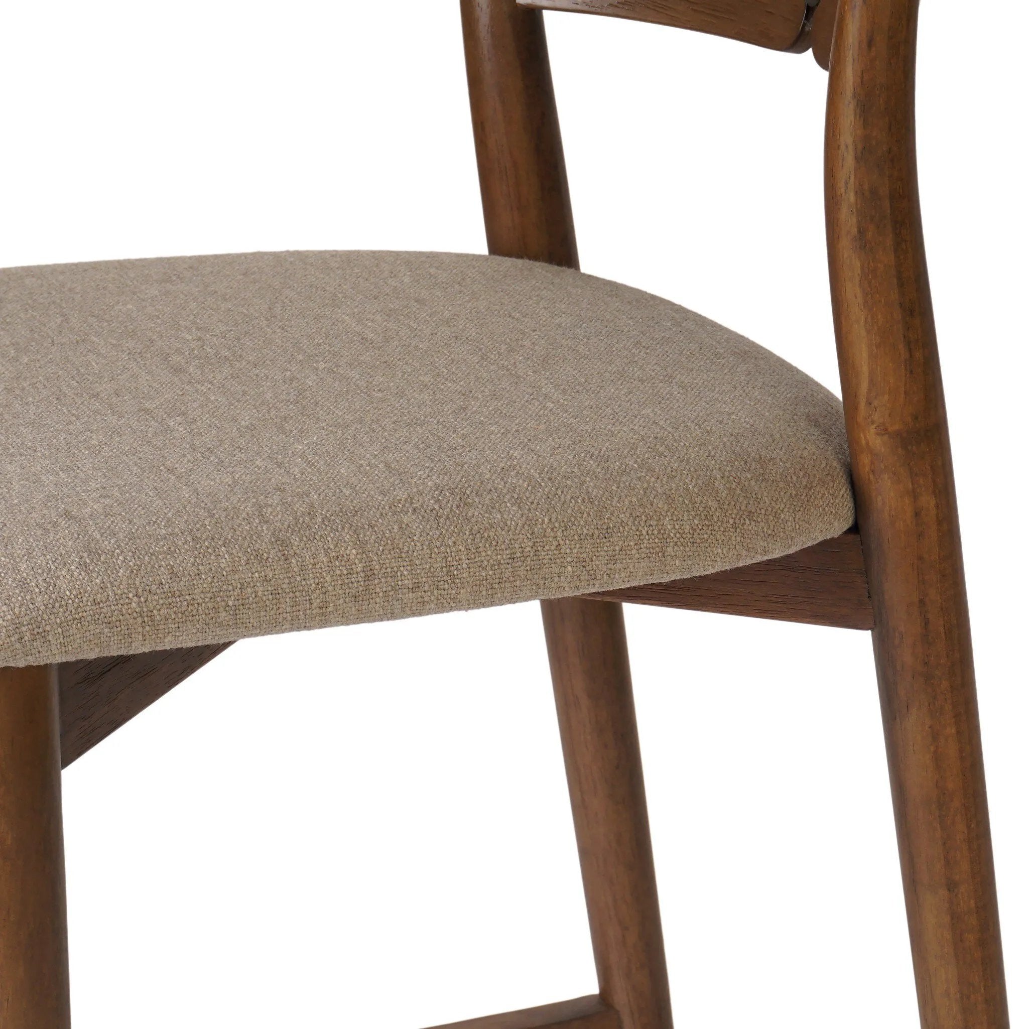 Inspired by simple Scandinavian styling, a tan-finished parawood stool's slit-back metal inlay adds a decorative touch. Easy curves from bent wood give a smooth silhouette. Sized for the counter and upholstered with a thin seat cushion in linen-cotton taupe Amethyst Home provides interior design, new home construction design consulting, vintage area rugs, and lighting in the Washington metro area.