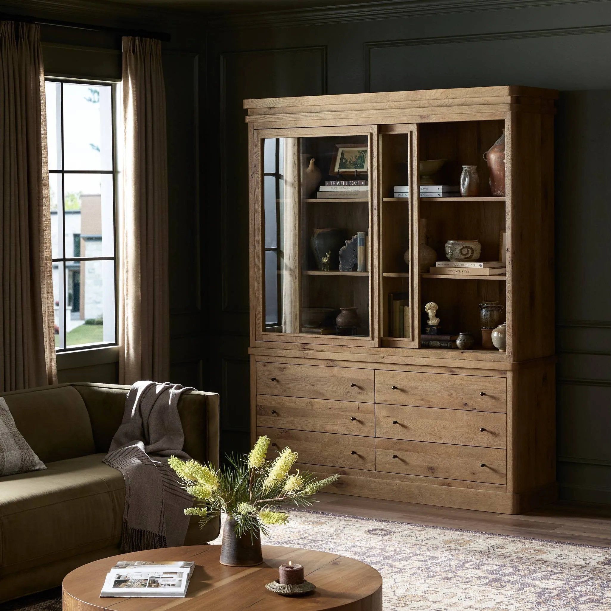 Large, traditional cabinetry of honey-finished oak brings a timeless look — and plenty of storage — to any room in the house. Sliding glass doors modernize this heritage-inspired piece, so you can style your favorite books and belongings. Six roomy drawers create endless storage possibilities for your space Amethyst Home provides interior design, new home construction design consulting, vintage area rugs, and lighting in the Portland metro area.