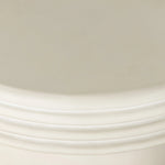 Statuesque and streamlined, an outdoor end table is crafted of smooth solid concrete and detailed with ribbed edging on top. Cover or store indoors during inclement weather and when not in use.As enthusiasts of wabi sabi design at Amethyst, we love the warm modern inspired Grecia Outdoor End Table. Amethyst Home provides interior design, new home construction design consulting, vintage area rugs, and lighting in the Boston metro area.