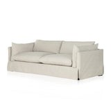 Featuring Habitat Bennett Moon Sofa by Four Hands at Amethyst Home. A slipcovered sofa made for modern living. Shelter arms and big, pillow-inspired cushions are covered in a durable comfortable fabric prime for lounging. Performance fabrics are specially created to withstand spills, stains, high traffic and wear, ensuring long-term comfort and unmatched d. Amethyst Home provides interior design, new home construction design consulting, vintage area rugs, and lighting in the Alpharetta metro area.