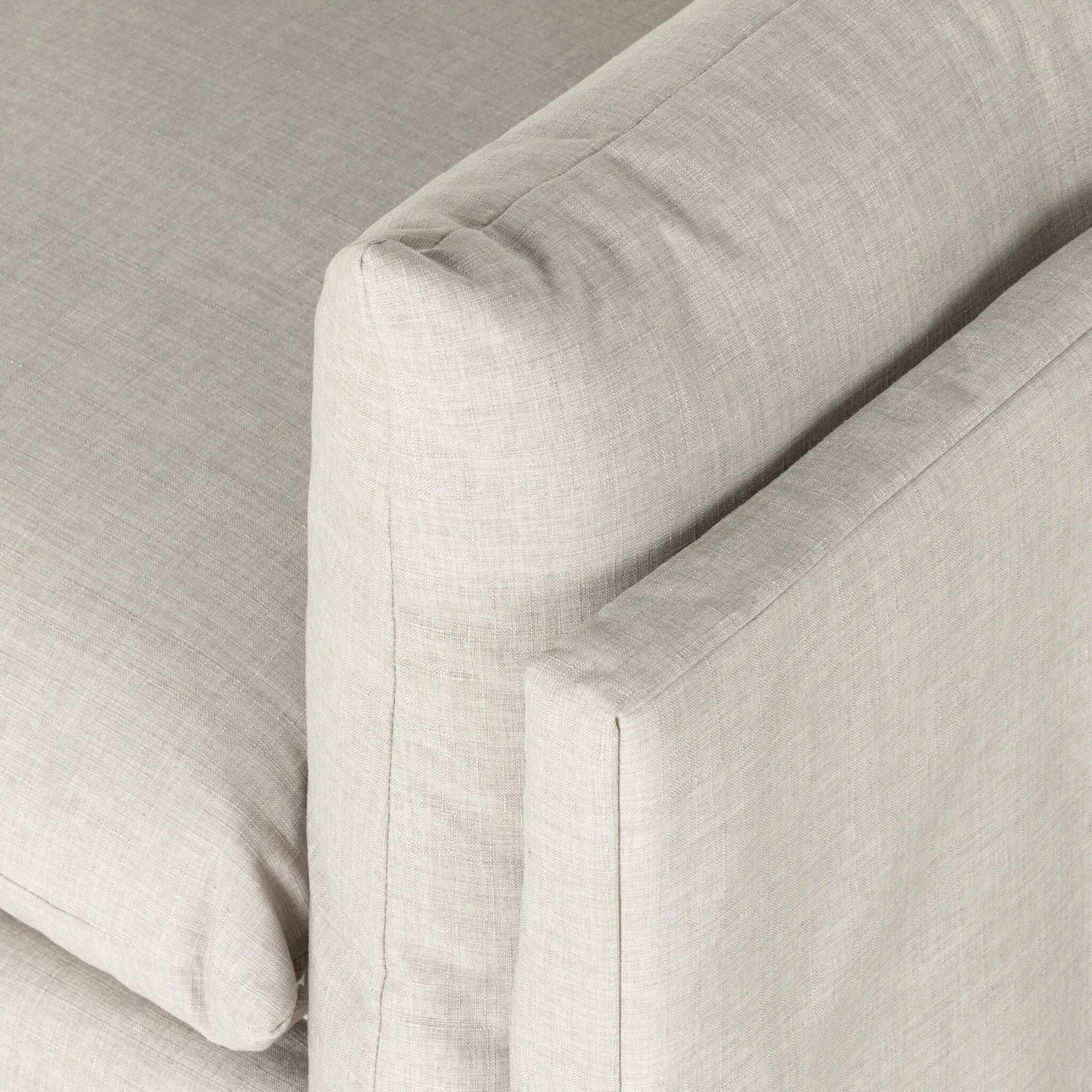 Featuring Habitat Bennett Moon Sofa by Four Hands at Amethyst Home. A slipcovered sofa made for modern living. Shelter arms and big, pillow-inspired cushions are covered in a durable comfortable fabric prime for lounging. Performance fabrics are specially created to withstand spills, stains, high traffic and wear, ensuring long-term comfort and unmatched. Amethyst Home provides interior design, new home construction design consulting, vintage area rugs, and lighting in the Laguna Beach metro area.