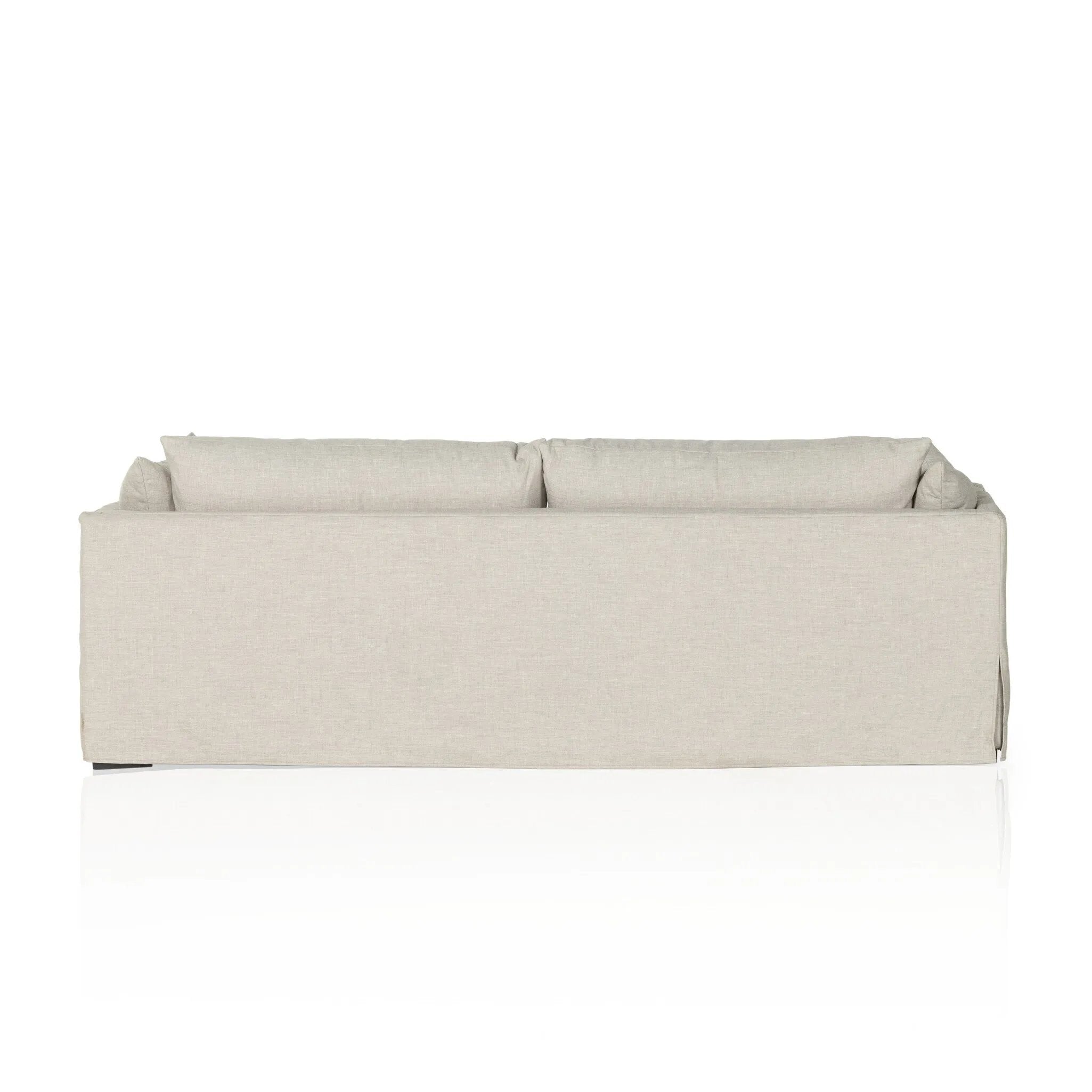 Featuring Habitat Bennett Moon Sofa by Four Hands at Amethyst Home. A slipcovered sofa made for modern living. Shelter arms and big, pillow-inspired cushions are covered in a durable comfortable fabric prime for lounging. Performance fabrics are specially created to withstand spills, stains, high traffic and wear, ensuring long-term comfort and unmatched dur. Amethyst Home provides interior design, new home construction design consulting, vintage area rugs, and lighting in the Portland metro area.