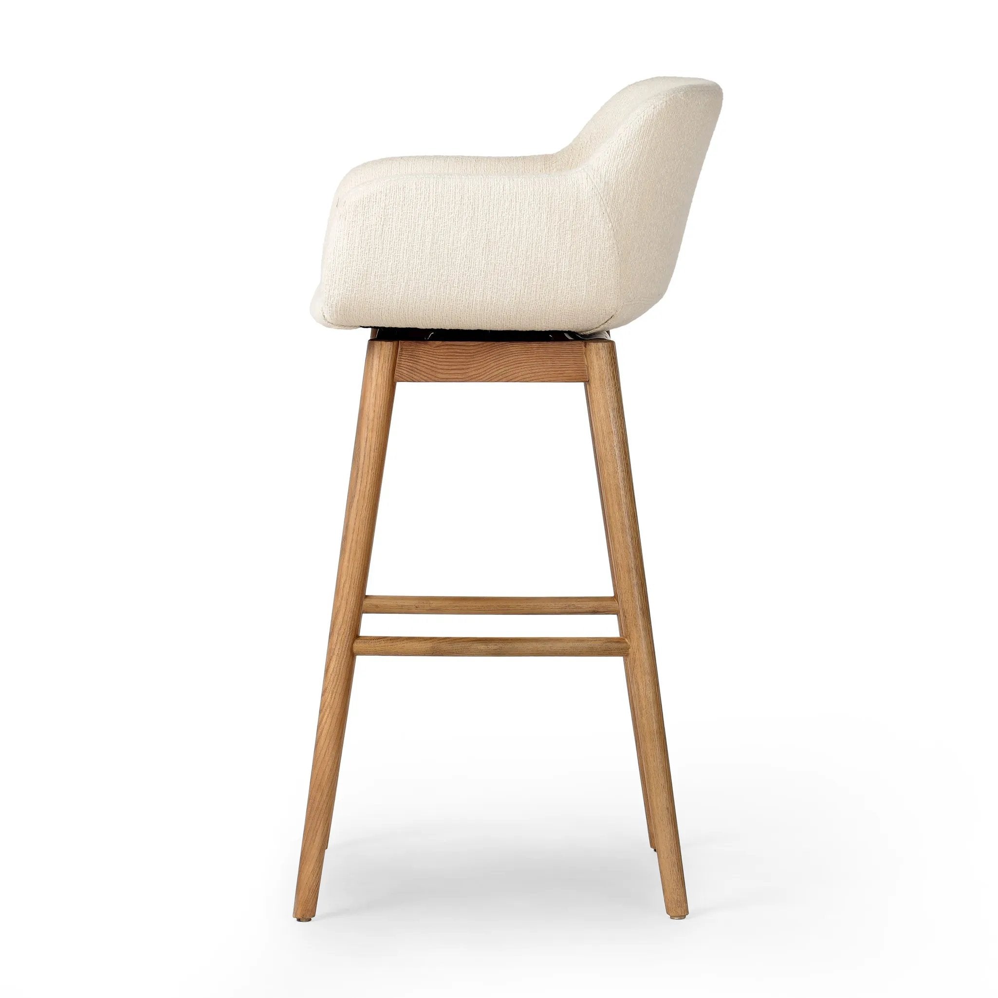 Featuring Hannah Kerbey Ivory Swivel Bar + Counter Stool by Four Hands at Amethyst Home. BarOverall Dimensions: 21.75"w x 20.50"d x 40.75"hWeight: 23.81 lbsCounterOverall Dimensions: 21.75"w x 20.50"d x 36.75"hWeight: 21.61 lbsMaterials: 96% Polyester, 4% Acrylic, Solid Ash, Poplar Plywood. Amethyst Home provides interior design, new home construction design consulting, vintage area rugs, and lighting in the Calabasas metro area.
