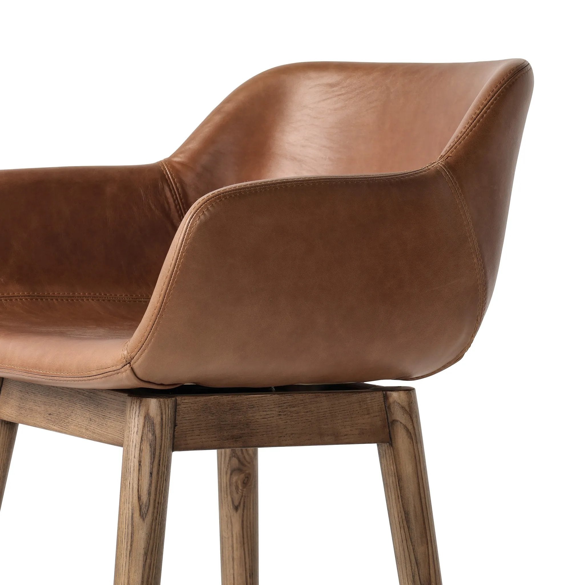 Featuring Hannah Sonoma Chestnut  Swivel Bar + Counter Stool by Four Hands at Amethyst Home. A midcentury-inspired counter stool gets refreshed with a modern memory swivel and chestnut top-grain leather. Slim, tapered oak legs balance a curved seat.BarOverall Dimensions: 21.75"w x 20.50"d x 40.75"hWeight: 23.81 lbsCounterOverall Dimensions: 21.75"w x 20.50". Amethyst Home provides interior design, new home construction design consulting, vintage area rugs, and lighting in the Calabasas metro area.