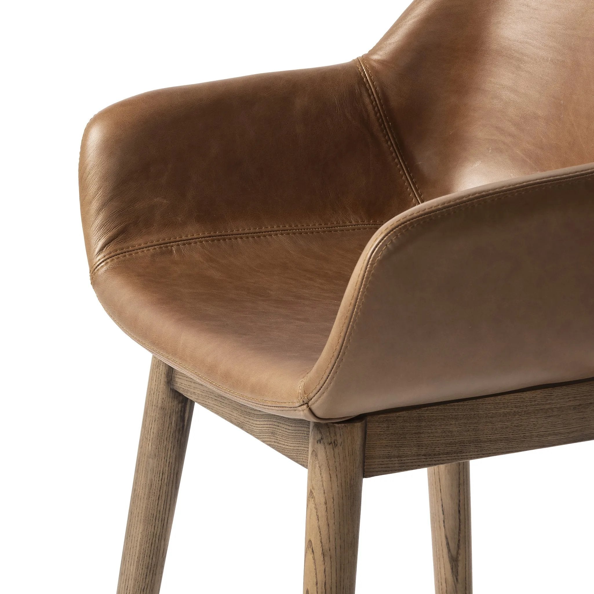 Featuring Hannah Sonoma Chestnut  Swivel Bar + Counter Stool by Four Hands at Amethyst Home. A midcentury-inspired counter stool gets refreshed with a modern memory swivel and chestnut top-grain leather. Slim, tapered oak legs balance a curved seat.BarOverall Dimensions: 21.75"w x 20.50"d x 40.75"hWeight: 23.81 lbsCounterOverall Dimensions: 21.75"w x 20. Amethyst Home provides interior design, new home construction design consulting, vintage area rugs, and lighting in the Newport Beach metro area.