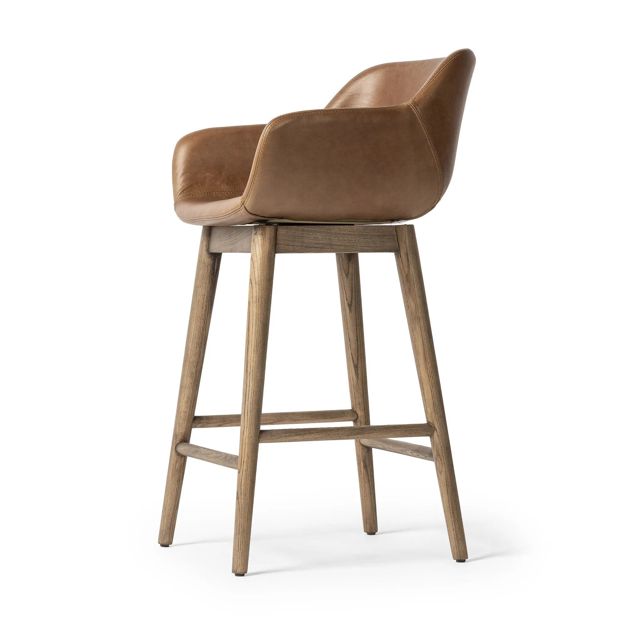 Featuring Hannah Sonoma Chestnut Swivel Counter Stool by Four Hands at Amethyst Home. Experience the ultimate in comfort and style with the Hannah Sonoma Chestnut Swivel Bar + Counter Stool. Featuring a durable and sleek design, this stool offers maximum support and functionality. With its smooth swivel motion, you can easily reach for things around you, making. Amethyst Home provides interior design, new home construction design consulting, vintage area rugs, and lighting in the Omaha metro area.