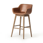 Featuring Hannah Sonoma Chestnut  Swivel Bar + Counter Stool by Four Hands at Amethyst Home. A midcentury-inspired counter stool gets refreshed with a modern memory swivel and chestnut top-grain leather. Slim, tapered oak legs balance a curved seat.BarOverall Dimensions: 21.75"w x 20.50"d x 40.75"hWeight: 23.81 lbsCounterOverall Dimensions: 21.75"w x 20.50". Amethyst Home provides interior design, new home construction design consulting, vintage area rugs, and lighting in the Park City metro area.