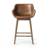 Featuring Hannah Sonoma Chestnut  Swivel Bar + Counter Stool by Four Hands at Amethyst Home. A midcentury-inspired counter stool gets refreshed with a modern memory swivel and chestnut top-grain leather. Slim, tapered oak legs balance a curved seat.BarOverall Dimensions: 21.75"w x 20.50"d x 40.75"hWeight: 23.81 lbsCounterOverall Dimensions: 21.75"w x 20. Amethyst Home provides interior design, new home construction design consulting, vintage area rugs, and lighting in the Winter Garden metro area.