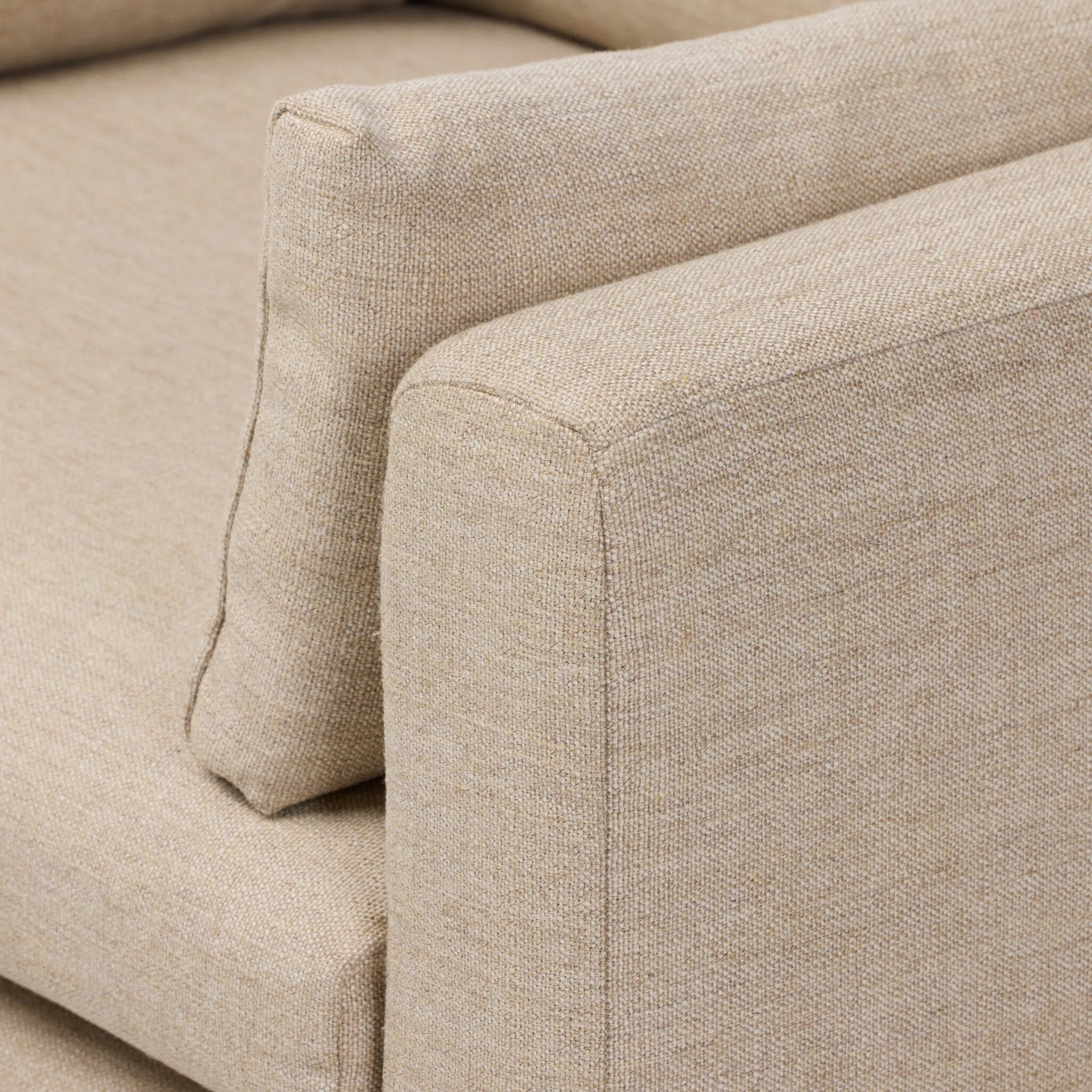 With traditional details like turned oak legs and brass casters, this low-profile accent chair features an elongated bench seat for an inviting sit. Performance fabric in neutral wheat finishes a knife-edge back and boxed arm cushions Amethyst Home provides interior design, new home construction design consulting, vintage area rugs, and lighting in the Kansas City metro area.