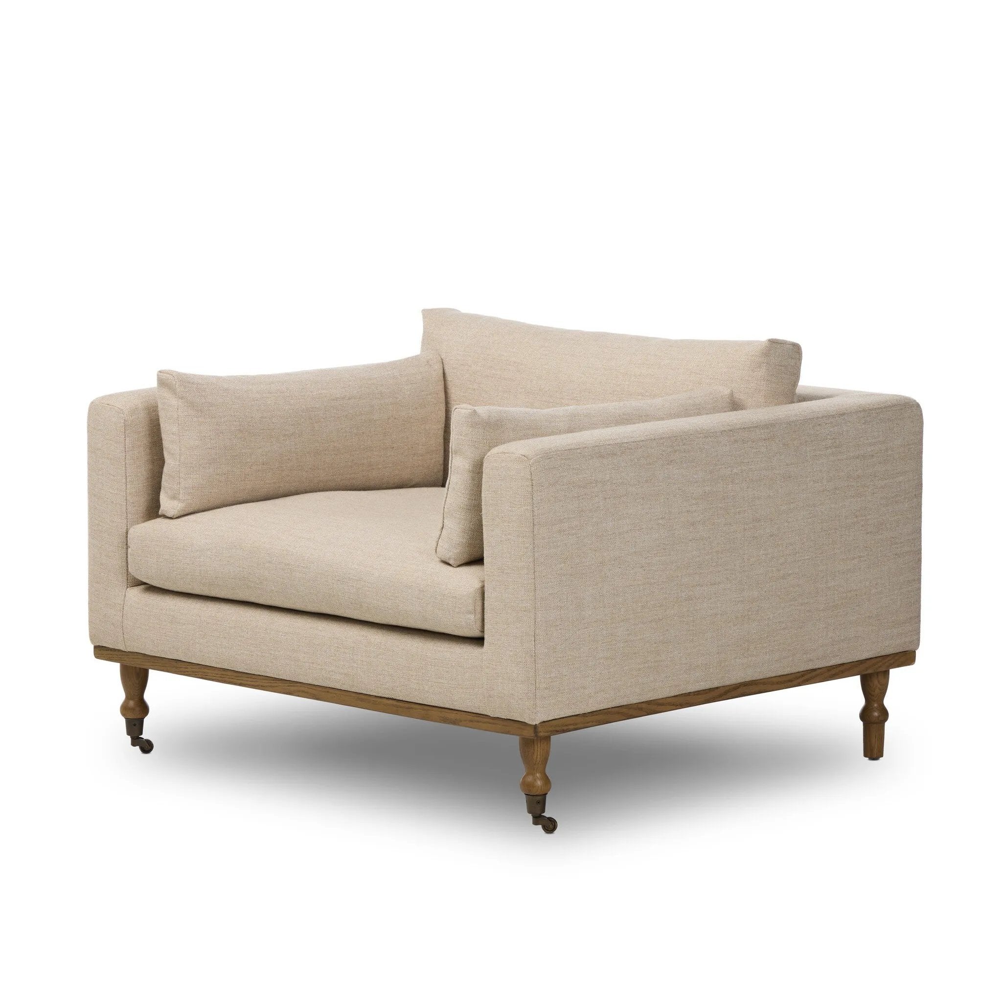 With traditional details like turned oak legs and brass casters, this low-profile accent chair features an elongated bench seat for an inviting sit. Performance fabric in neutral wheat finishes a knife-edge back and boxed arm cushions Amethyst Home provides interior design, new home construction design consulting, vintage area rugs, and lighting in the Laguna Beach metro area.