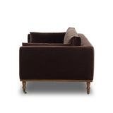 Mid-century modern with a dash of vintage detail, this bench-style sofa makes a statement. With traditional details like turned oak legs and brass casters, this low-profile sofa features an elongated bench seat for an inviting sit. Velvety chocolate-brown upholstery finishes a knife-edge back and boxed arm cushions Amethyst Home provides interior design, new home construction design consulting, vintage area rugs, and lighting in the Alpharetta metro area.