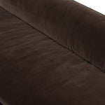 Mid-century modern with a dash of vintage detail, this bench-style sofa makes a statement. With traditional details like turned oak legs and brass casters, this low-profile sofa features an elongated bench seat for an inviting sit. Velvety chocolate-brown upholstery finishes a knife-edge back and boxed arm cushions Amethyst Home provides interior design, new home construction design consulting, vintage area rugs, and lighting in the Nashville metro area.
