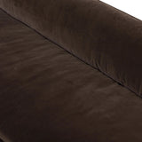 Mid-century modern with a dash of vintage detail, this bench-style sofa makes a statement. With traditional details like turned oak legs and brass casters, this low-profile sofa features an elongated bench seat for an inviting sit. Velvety chocolate-brown upholstery finishes a knife-edge back and boxed arm cushions Amethyst Home provides interior design, new home construction design consulting, vintage area rugs, and lighting in the Nashville metro area.