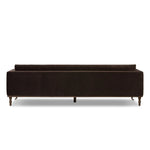 Mid-century modern with a dash of vintage detail, this bench-style sofa makes a statement. With traditional details like turned oak legs and brass casters, this low-profile sofa features an elongated bench seat for an inviting sit. Velvety chocolate-brown upholstery finishes a knife-edge back and boxed arm cushions Amethyst Home provides interior design, new home construction design consulting, vintage area rugs, and lighting in the Portland metro area.