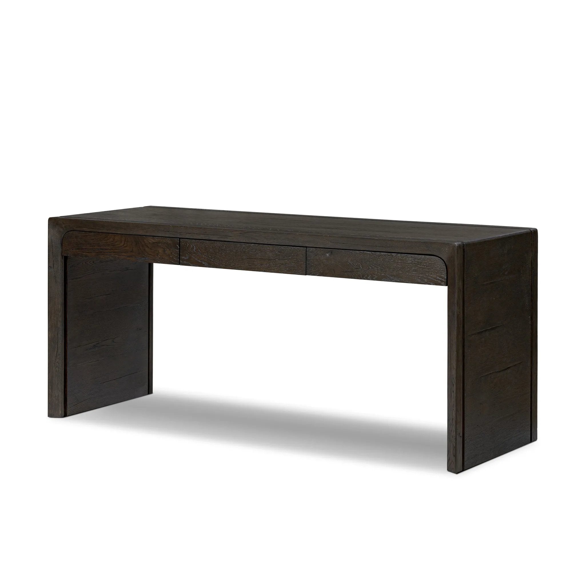 Featuring Henry Charcoal Oak Thick Veneer Desk by Four Hands at Amethyst Home. Made from solid reclaimed oak finished in a rustic charcoal, this slim-profile desk shapes subtly curved corners, bringing a handcrafted look to a minimalist form. Designed in partnership with longtime Four Hands collaborator Thomas Bina and Brazilian designer Ronald Sasson.Over. Amethyst Home provides interior design, new home construction design consulting, vintage area rugs, and lighting in the Scottsdale metro area.