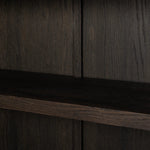 With rounded sides inspired by Eighties design, almond-finished oak brings depth into any room in your home. Spacious shelves create endless storage and display options for favorite books and keepsakes, all visible through clear tempered glass Amethyst Home provides interior design, new home construction design consulting, vintage area rugs, and lighting in the Dallas metro area.