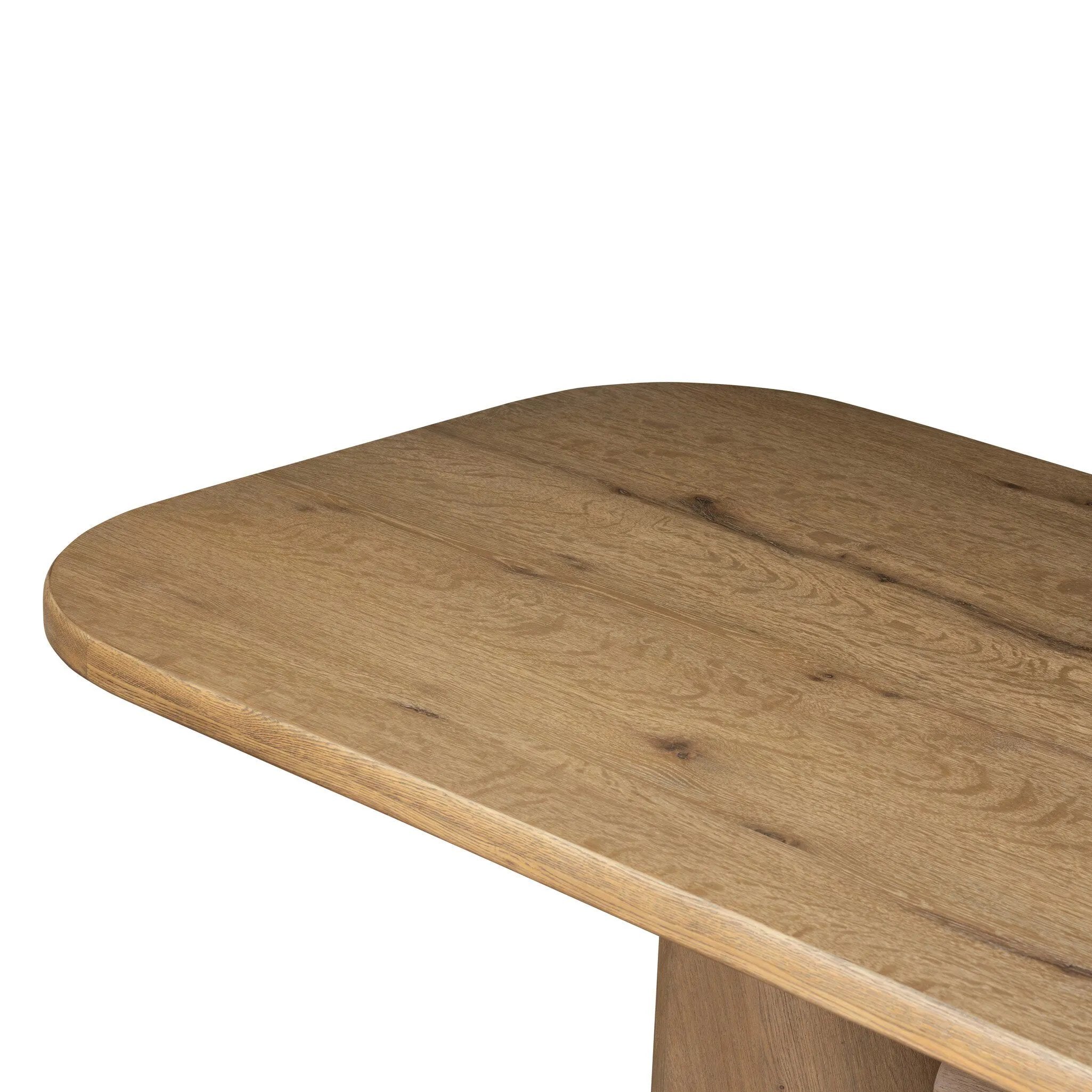 This modern take on the traditional trestle table features two angular bases, mirrored and united by softened square center beam. Dramatically angled legs pull the eye toward beautifully curved detailing. Crafted of oak with a light, natural finish. Amethyst Home provides interior design, new home construction design consulting, vintage area rugs, and lighting in the Houston metro area.