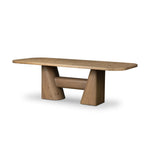 This modern take on the traditional trestle table features two angular bases, mirrored and united by softened square center beam. Dramatically angled legs pull the eye toward beautifully curved detailing. Crafted of oak with a light, natural finish. Amethyst Home provides interior design, new home construction design consulting, vintage area rugs, and lighting in the Kansas City metro area.