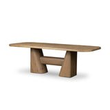 This modern take on the traditional trestle table features two angular bases, mirrored and united by softened square center beam. Dramatically angled legs pull the eye toward beautifully curved detailing. Crafted of oak with a light, natural finish. Amethyst Home provides interior design, new home construction design consulting, vintage area rugs, and lighting in the Kansas City metro area.