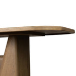This modern take on the traditional trestle table features two angular bases, mirrored and united by softened square center beam. Dramatically angled legs pull the eye toward beautifully curved detailing. Crafted of oak with a light, natural finish. Amethyst Home provides interior design, new home construction design consulting, vintage area rugs, and lighting in the Monterey metro area.