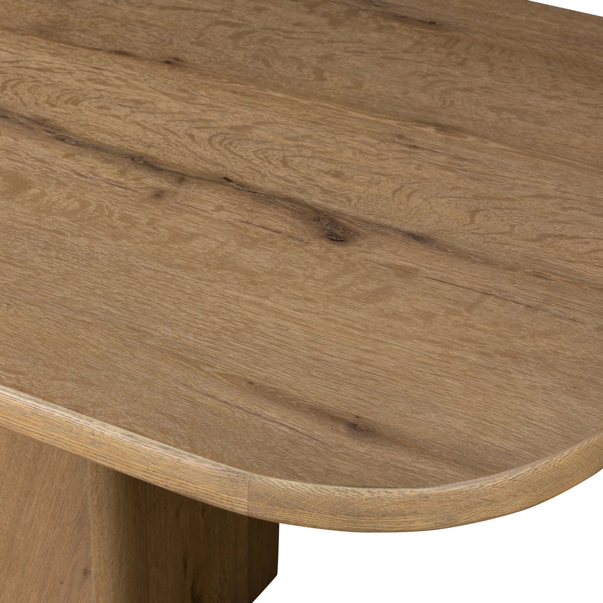 This modern take on the traditional trestle table features two angular bases, mirrored and united by softened square center beam. Dramatically angled legs pull the eye toward beautifully curved detailing. Crafted of oak with a light, natural finish. Amethyst Home provides interior design, new home construction design consulting, vintage area rugs, and lighting in the San Diego metro area.