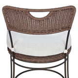 A light, airy take on the traditional bistro shape. This outdoor dining chair features exaggerated splayed legs and a curved X-shaped stretcher, with a handle detail cut out of the woven seat back. Finished with a seat cushion. Cover or store indoors during inclement weather and when not in use. Amethyst Home provides interior design, new home construction design consulting, vintage area rugs, and lighting in the Charlotte metro area.