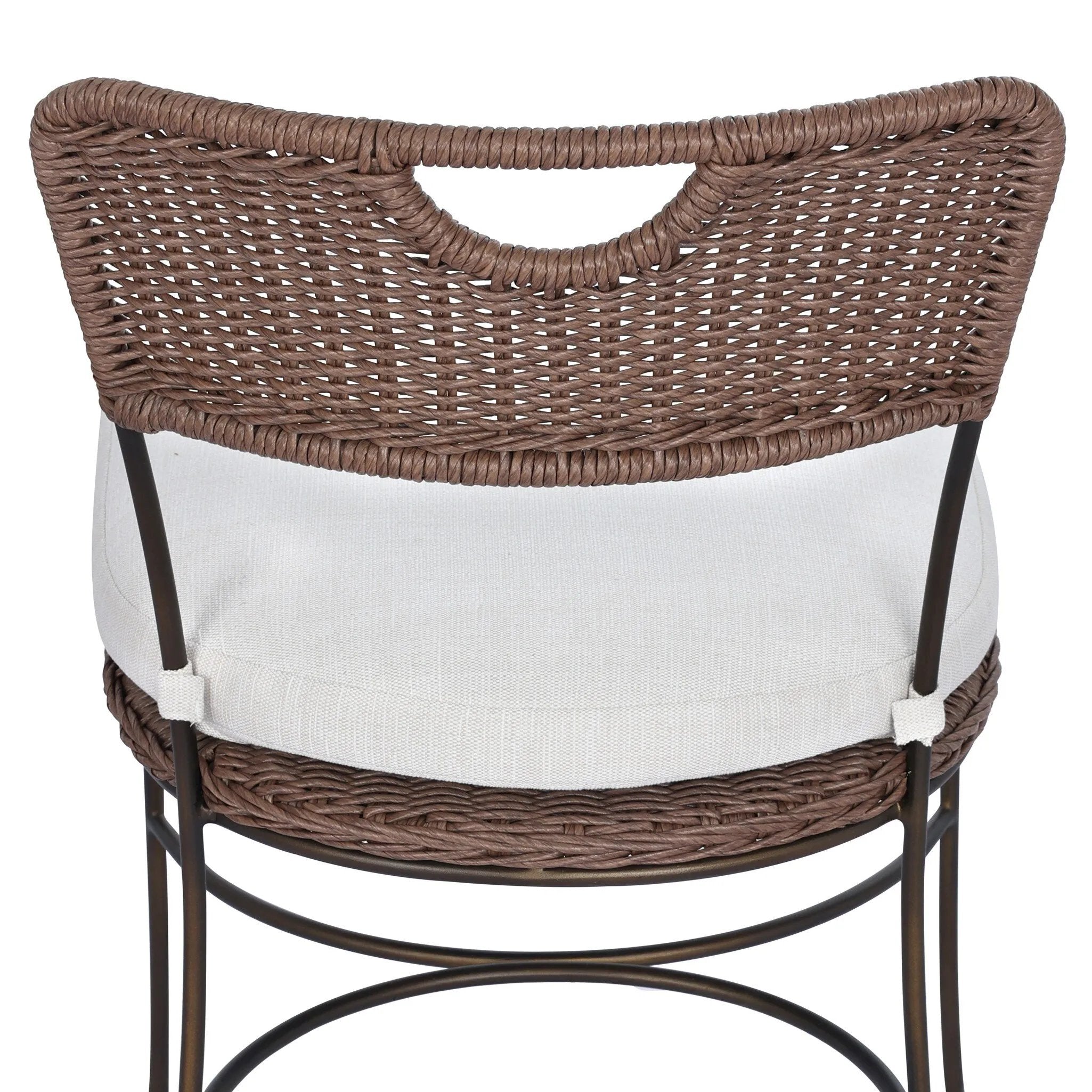 A light, airy take on the traditional bistro shape. This outdoor dining chair features exaggerated splayed legs and a curved X-shaped stretcher, with a handle detail cut out of the woven seat back. Finished with a seat cushion. Cover or store indoors during inclement weather and when not in use. Amethyst Home provides interior design, new home construction design consulting, vintage area rugs, and lighting in the Charlotte metro area.