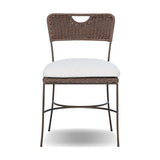 A light, airy take on the traditional bistro shape. This outdoor dining chair features exaggerated splayed legs and a curved X-shaped stretcher, with a handle detail cut out of the woven seat back. Finished with a seat cushion. Cover or store indoors during inclement weather and when not in use. Amethyst Home provides interior design, new home construction design consulting, vintage area rugs, and lighting in the Kansas City metro area.