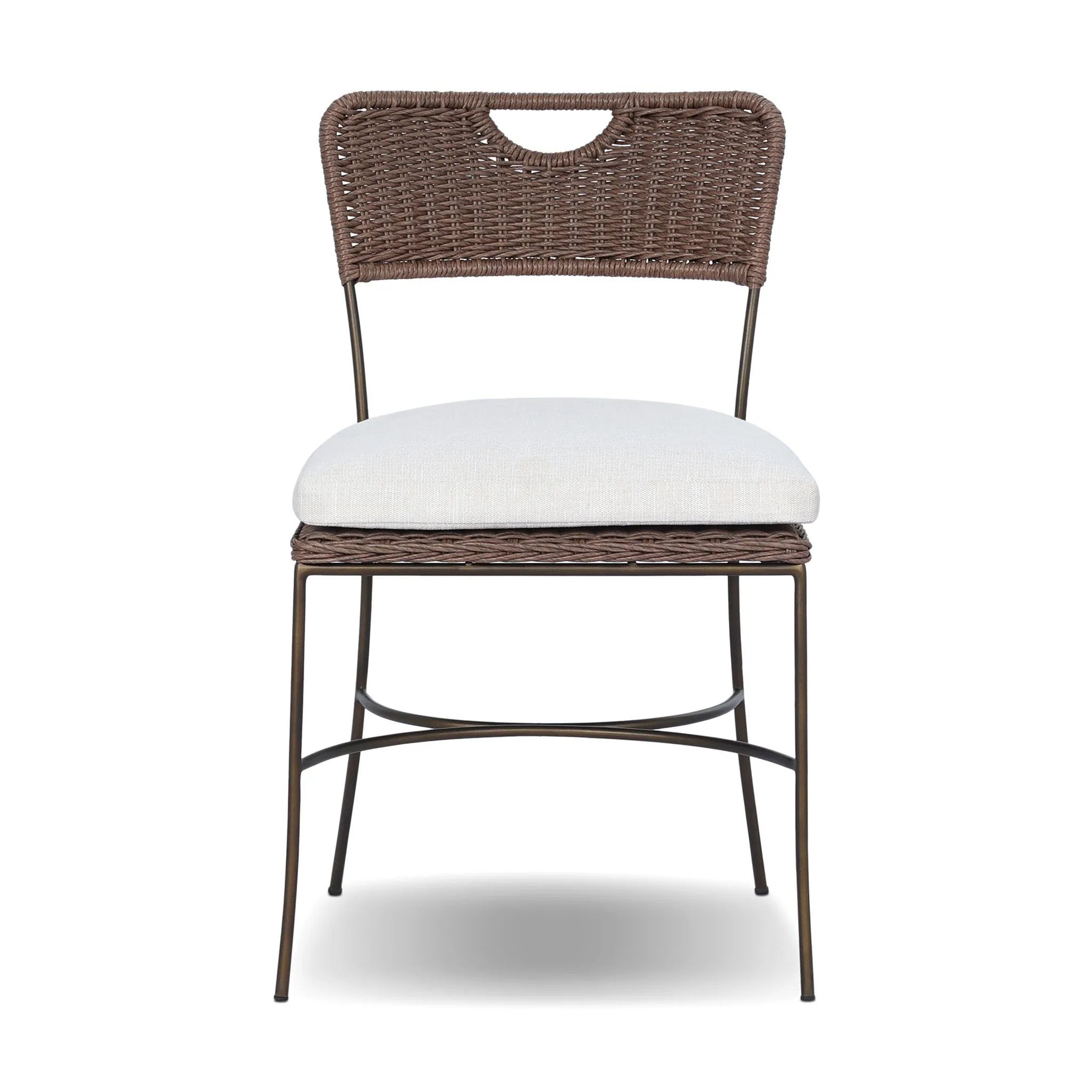 A light, airy take on the traditional bistro shape. This outdoor dining chair features exaggerated splayed legs and a curved X-shaped stretcher, with a handle detail cut out of the woven seat back. Finished with a seat cushion. Cover or store indoors during inclement weather and when not in use. Amethyst Home provides interior design, new home construction design consulting, vintage area rugs, and lighting in the Kansas City metro area.