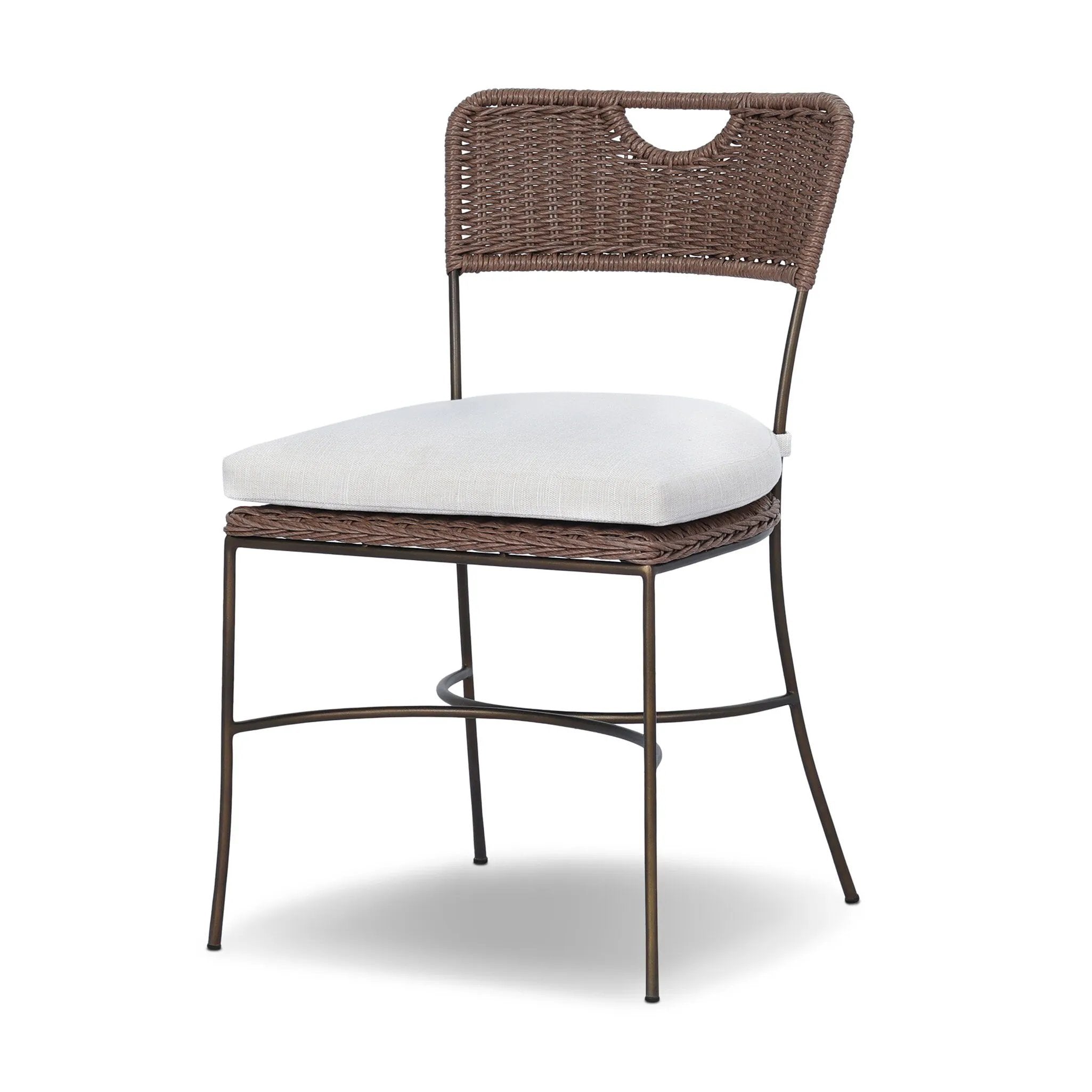 A light, airy take on the traditional bistro shape. This outdoor dining chair features exaggerated splayed legs and a curved X-shaped stretcher, with a handle detail cut out of the woven seat back. Finished with a seat cushion. Cover or store indoors during inclement weather and when not in use. Amethyst Home provides interior design, new home construction design consulting, vintage area rugs, and lighting in the Nashville metro area.
