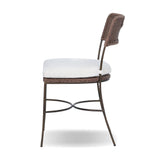 A light, airy take on the traditional bistro shape. This outdoor dining chair features exaggerated splayed legs and a curved X-shaped stretcher, with a handle detail cut out of the woven seat back. Finished with a seat cushion. Cover or store indoors during inclement weather and when not in use. Amethyst Home provides interior design, new home construction design consulting, vintage area rugs, and lighting in the Winter Garden metro area.