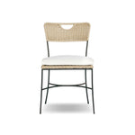 A light, airy take on the traditional bistro shape. This outdoor dining chair features exaggerated splayed legs and a curved X-shaped stretcher, with a handle detail cut out of the woven seat back. Finished with a seat cushion. Cover or store indoors during inclement weather and when not in use. Amethyst Home provides interior design, new home construction design consulting, vintage area rugs, and lighting in the Kansas City metro area.