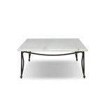 Inspired by Art Deco designs, this outdoor coffee table introduces a sense of movement to a classic silhouette. Graceful, flowing lines on the base pair with a white marble top for a classic black-and-white look. Cover or store inside during inclement weather and when not in use. Amethyst Home provides interior design, new home construction design consulting, vintage area rugs, and lighting in the Boston metro area.