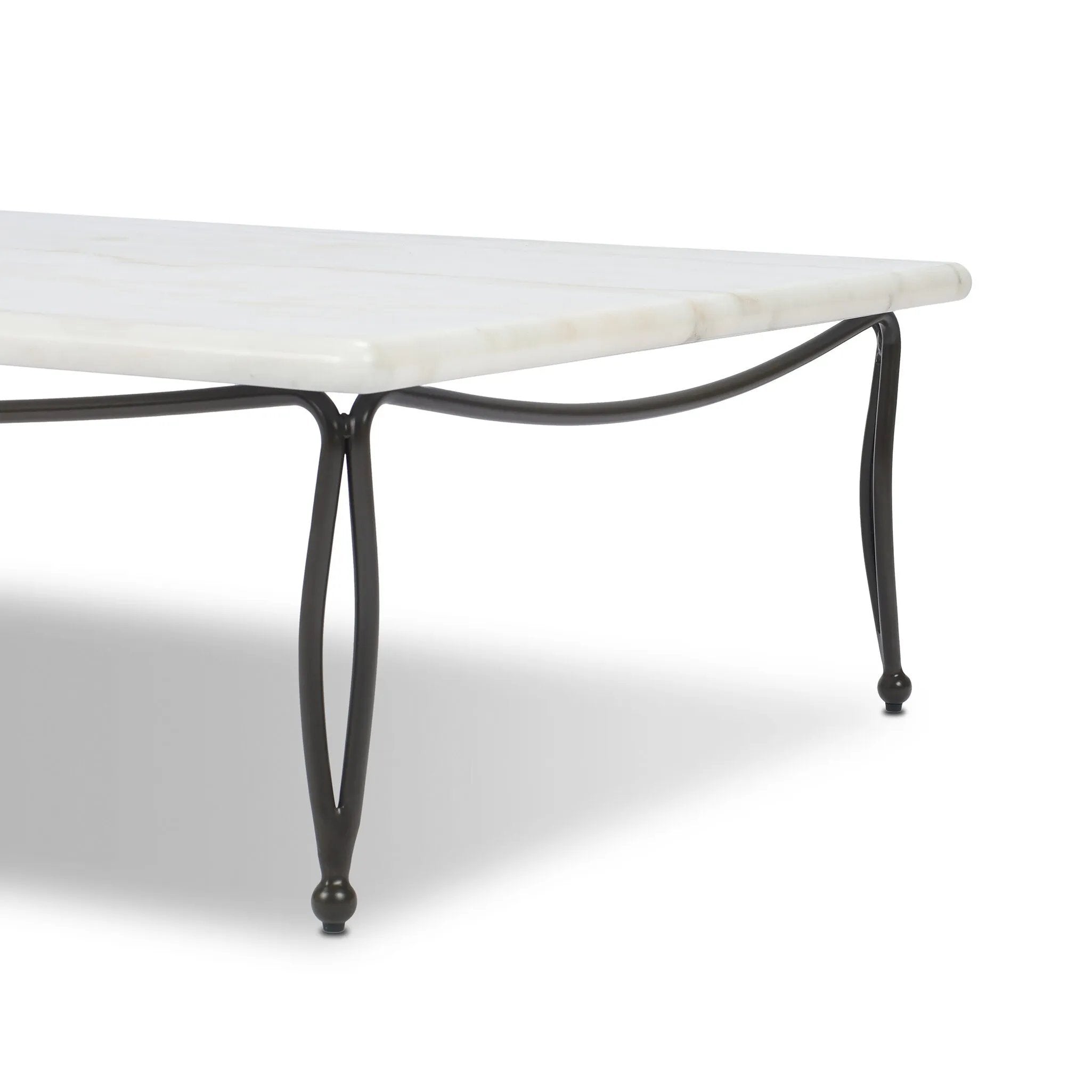 Inspired by Art Deco designs, this outdoor coffee table introduces a sense of movement to a classic silhouette. Graceful, flowing lines on the base pair with a white marble top for a classic black-and-white look. Cover or store inside during inclement weather and when not in use. Amethyst Home provides interior design, new home construction design consulting, vintage area rugs, and lighting in the Park City metro area.