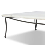 Inspired by Art Deco designs, this outdoor coffee table introduces a sense of movement to a classic silhouette. Graceful, flowing lines on the base pair with a white marble top for a classic black-and-white look. Cover or store inside during inclement weather and when not in use. Amethyst Home provides interior design, new home construction design consulting, vintage area rugs, and lighting in the Washington metro area.
