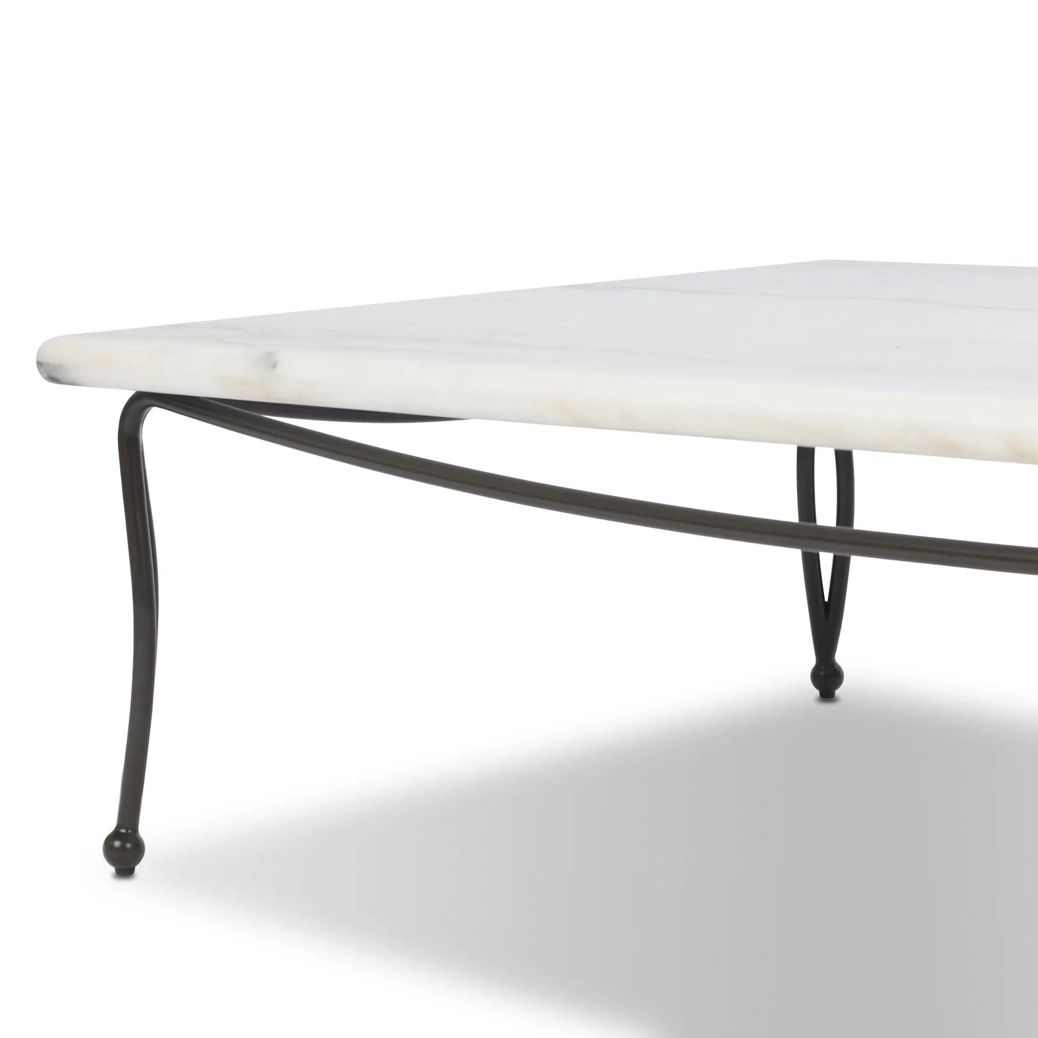 Inspired by Art Deco designs, this outdoor coffee table introduces a sense of movement to a classic silhouette. Graceful, flowing lines on the base pair with a white marble top for a classic black-and-white look. Cover or store inside during inclement weather and when not in use. Amethyst Home provides interior design, new home construction design consulting, vintage area rugs, and lighting in the Washington metro area.