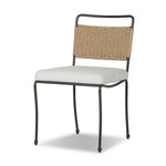 Inspired by Art Deco designs, this outdoor dining chair introduces a sense of movement to a classic silhouette. Subtly curved metal framing, a woven back and upholstered seat cushion craft a thoughtful mix of materials. Cover or store inside during inclement weather and when not in use. Amethyst Home provides interior design, new home construction design consulting, vintage area rugs, and lighting in the Kansas City metro area.
