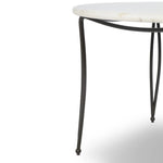 Inspired by Art Deco designs, this outdoor bistro dining table introduces a sense of movement to a classic silhouette. Graceful, flowing lines on the base pair with a white marble top for a classic black-and-white look. Cover or store inside during inclement weather and when not in use. Amethyst Home provides interior design, new home construction design consulting, vintage area rugs, and lighting in the Houston metro area.